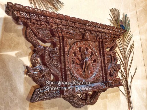 carved wooden peacock and dragon