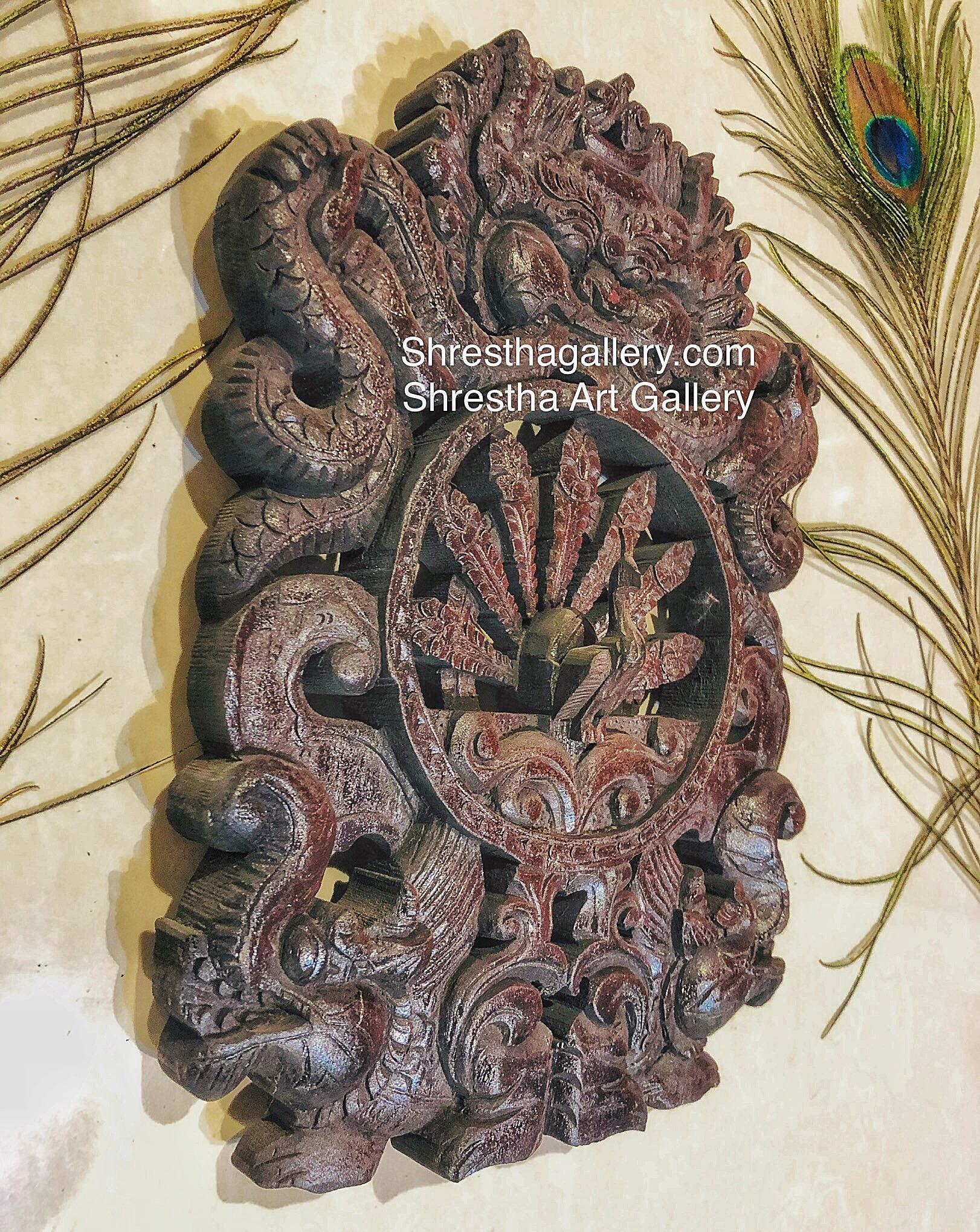 carved wooden peacock and bhairav